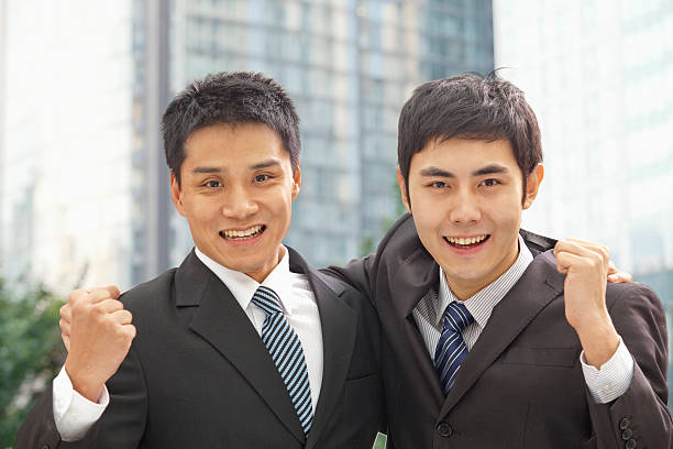 istock Portrait of Two Businessmen Cheering 187009838