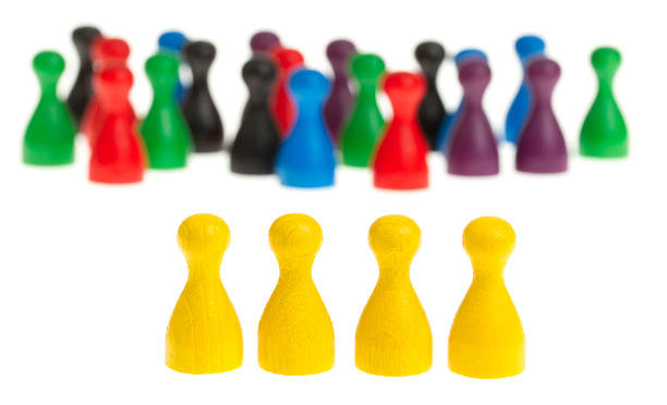 istock Four yellow pawns 187011304