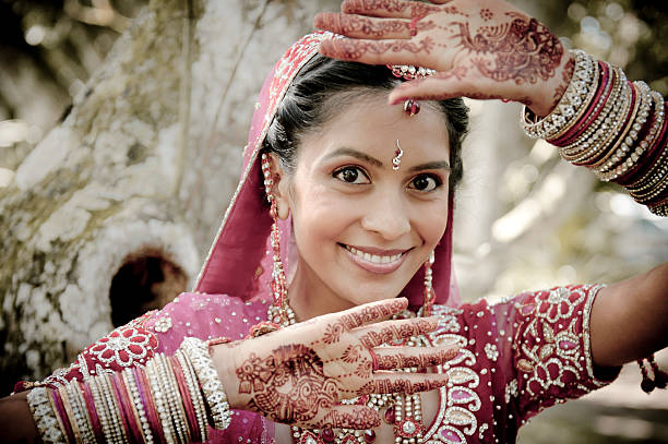 Young Indian woman with henna and a traditional dress stock photo
