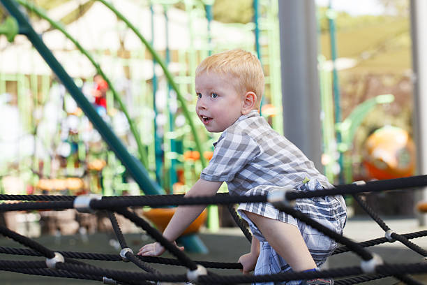istock Little Boy playing on a playground 187011814