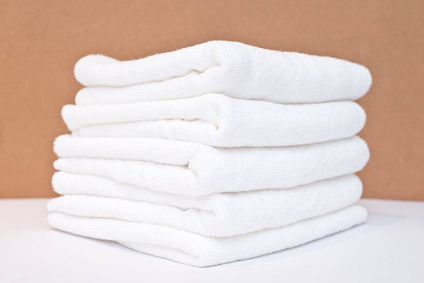 istock white towel on bed 187011910