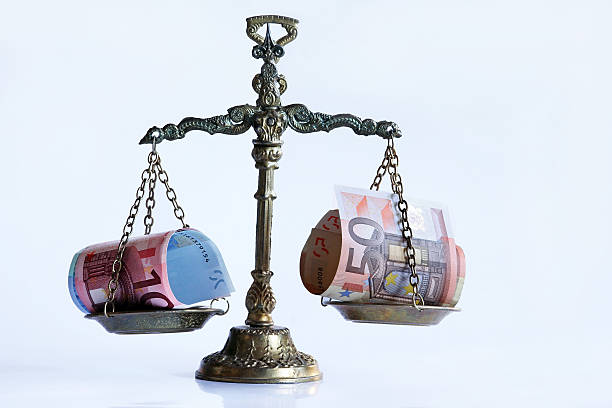 The scales The money on the scales. The euro in the balance tie game stock pictures, royalty-free photos & images