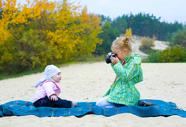 istock Five-year-old photographer with small model 187014482
