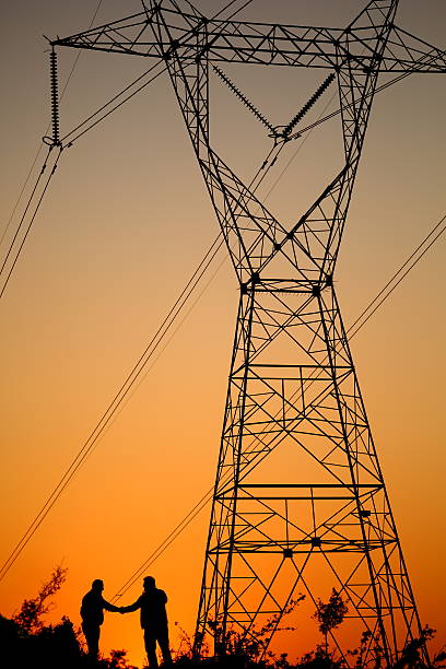 istock Power Lines and Handshake 187016820