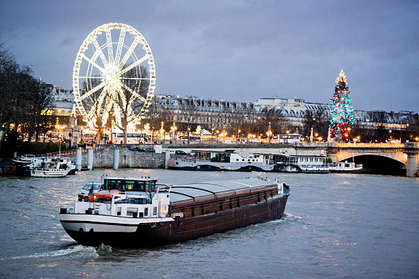 Avenue Champs-Elysees with Christmas illumination and ferris wheel at horizon in Paris, France. Champs-Elysees is one of the most famous streets in the world.