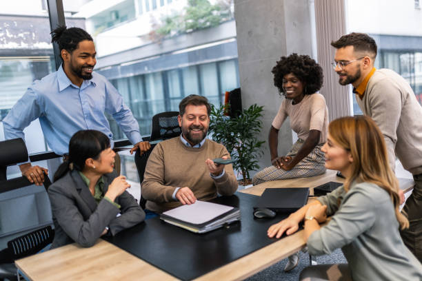 istock International workers group and team leader speaking to someone on voice call 1870172513