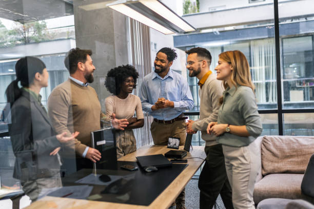 istock Multiethnic colleagues applaud their boss after he finished his speech 1870173047