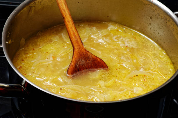 istock Preparing onion soup in cooking pot 1870179777