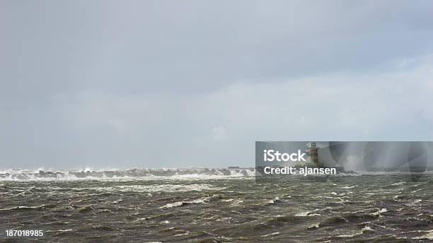 Very Rough Sea Splashing Lighthouse During A Storm Stock Photo - Download Image Now - Beach, Blue, Breaking Wave