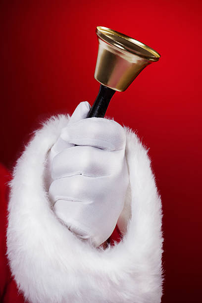 istock Santa holding handbell 187019230