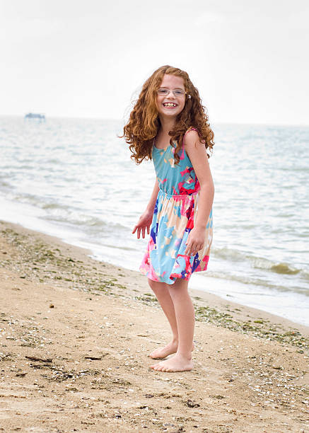 istock Beautiful girl walks on the beach 187019278