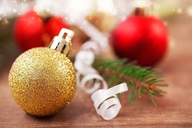 istock Red an golden baubles with pine branches on plank 187019334