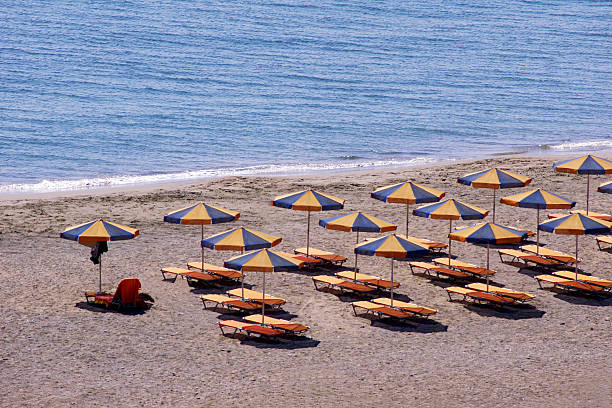 istock Parasols and sun loungers on the beach 187020040