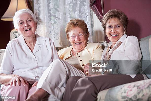 Elderly Women On Living Room Sofa Stock Photo - Download Image Now - Laughing, Only Women, Senior Adult