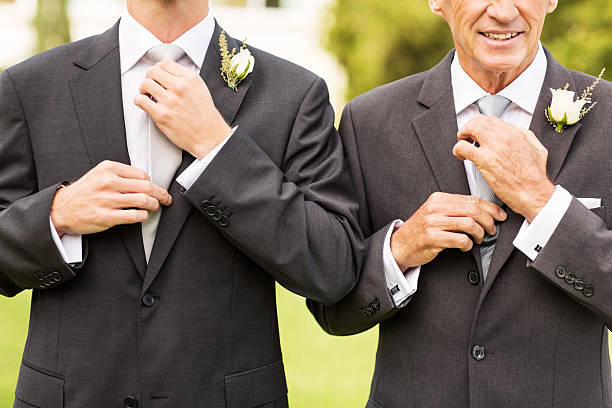 istock Groom And Father Adjusting Necktie In Garden 187020781