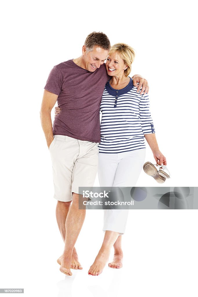 Portrait of relaxed mature couple together Portrait of relaxed mature couple together on white background Senior Couple Stock Photo