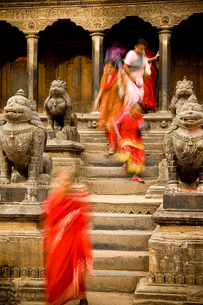 Durbar Square Patan Hindu devotee's leaving Jagan Narayan Temple in Durbar Square located in Patan, Nepal. Patan is one of the major cities of Nepal located in the south-central part of Kathmandu Valley in the Bagmati zone. patan durbar square stock pictures, royalty-free photos & images