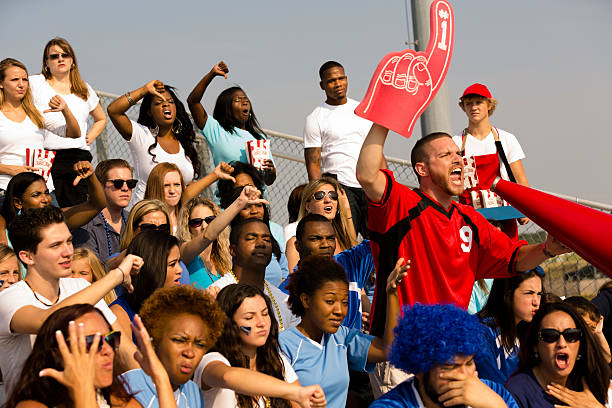 istock Sports: One fan cheers, others 'boo' for opposite team. 187021308