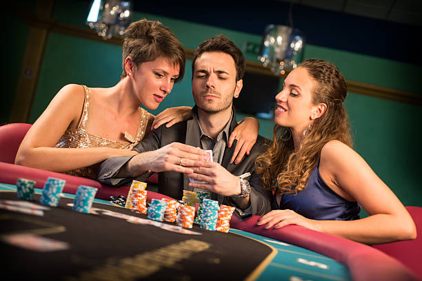 istock Casino. Poker Player Checking His Cards 187021337