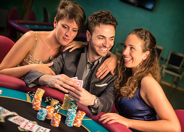 istock Casino. Poker Player with Two Women 187021353