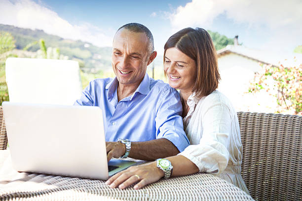 istock Adult couple surfing the net on computer 187021364