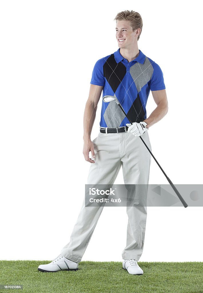 Szczęśliwy Golfista stojące na pole golfowe - Zbiór zdjęć royalty-free (Golfista)