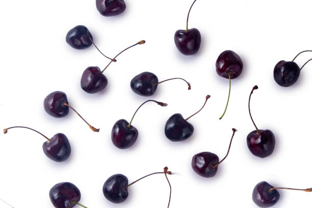 istock A fresh vivid red cherry isolated on white background 1870216908