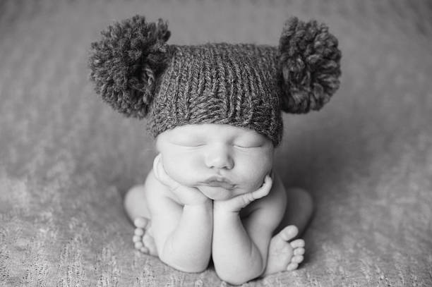 istock Newborn Boy Sleeping in Knit Hat 187022027