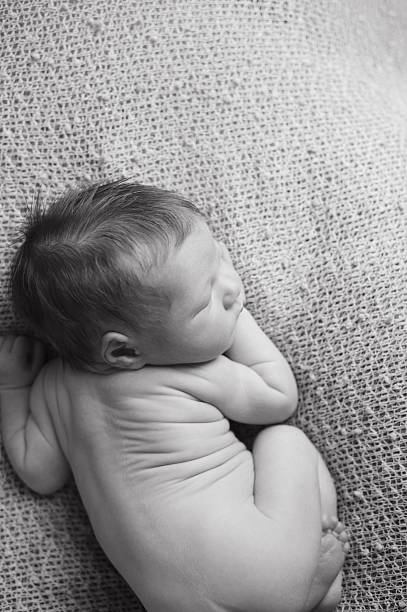 istock Aerial View of Newborn Boy Sleeping on Belly 187022041