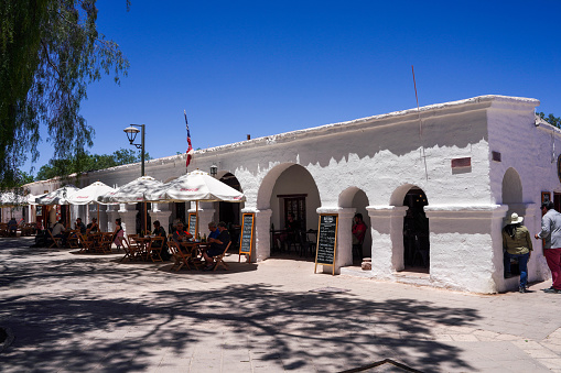 Antofagasta Region, Chile October 25,2023:Tourists at coffee shop in Plaza San Pedro de Atacama - Atacama Desert, Chile