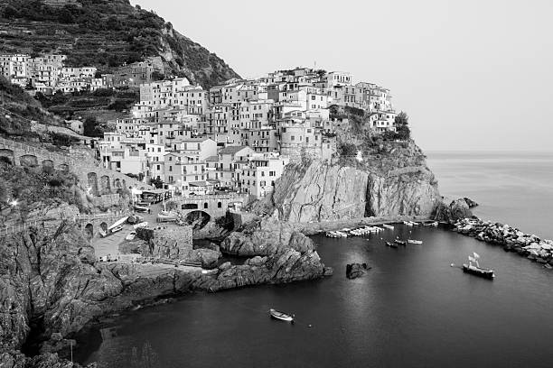 The picture postcard hamlet of Manarola is one of five Cinque Terre towns on the Italian Riviera. Here, it is illuminated at dusk.