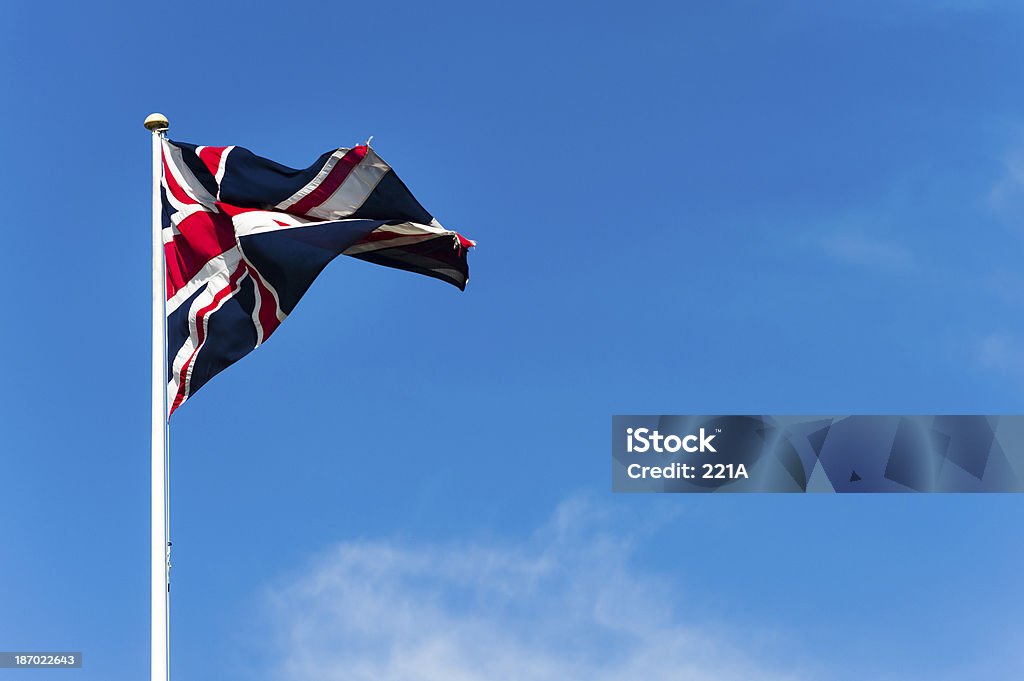 Union Jack avion contre le ciel bleu sur un jour venteux - Photo de Bleu libre de droits