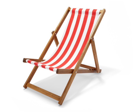 Studio photo of a red striped deck chair isolated on white with clipping path.