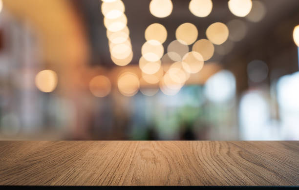 istock Mock up for space. Empty dark wooden table in front of abstract blurred bokeh background of restaurant . can be used for display or montage your product 1870259366