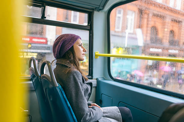 istock Woman in a double london bus 187027706