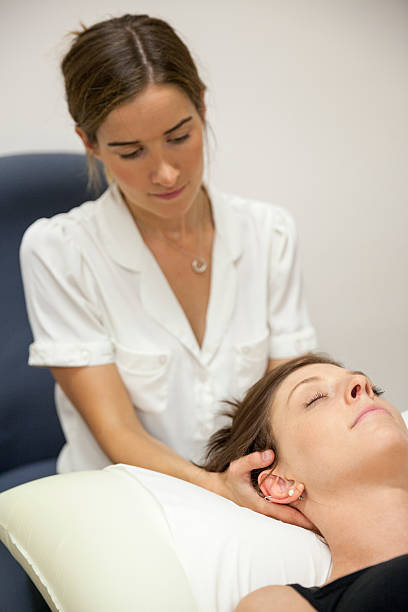 istock Physical Therapist Series: neck massage 187030040