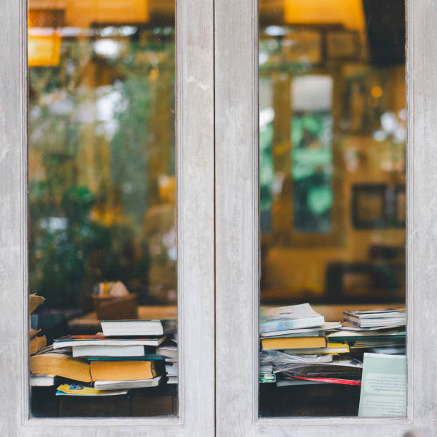istock Book stack in the library room and blurred bookshelf background for business, education and back to school concept 1870300497