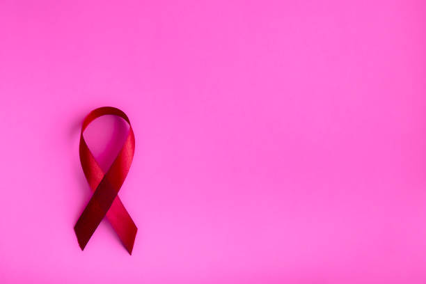 istock Pink ribbon on a delicate background, top view with space for text. Campaign to help people facing cancer. 1870303120
