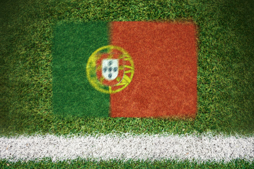Portugal flag printed on a soccer field.