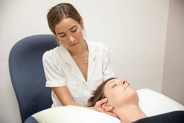 istock Physical Therapist Series: neck massage 187031635