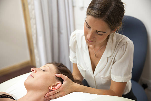 istock Physical Therapist Series: neck massage 187031637