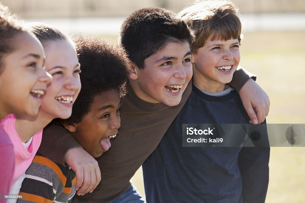 Group of childen Multi-ethnic group of elementary school children (9 to 11 years). Main focus on Hispanic boy, second from right. Autumn Stock Photo Group of childen Multi-ethnic group of elementary school children (9 to 11 years). Main focus on Hispanic boy, second from right. Autumn Stock Photo