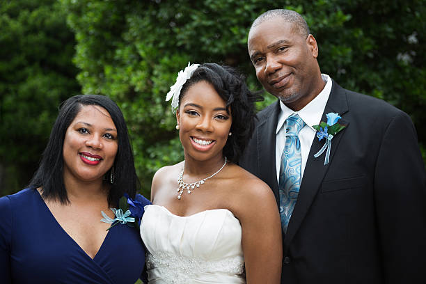 full-length portrait of the newlyweds and their friends at the wedding. The bride and groom with bridesmaids and friends of the groom are having fun and rejoicing at the wedding.