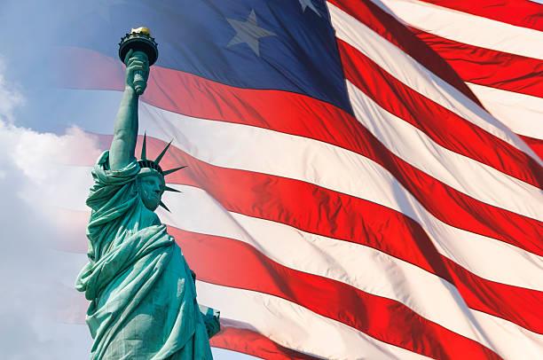 istock Statue of Liberty with US Flag in the background 187032571