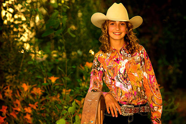 istock Beautiful young cowgirl 187032866
