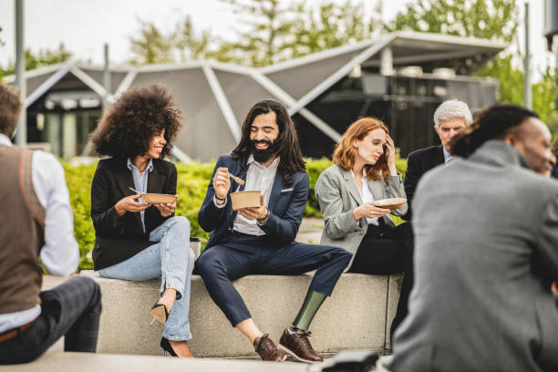 istock multigenerational and inclusive group of coworkers taking a break from work in the yard 1870330453