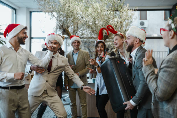 istock Fun Times During Christmas Karaoke Office Party 1870338877