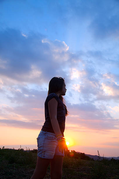 istock Child  girl at sunset 187034006