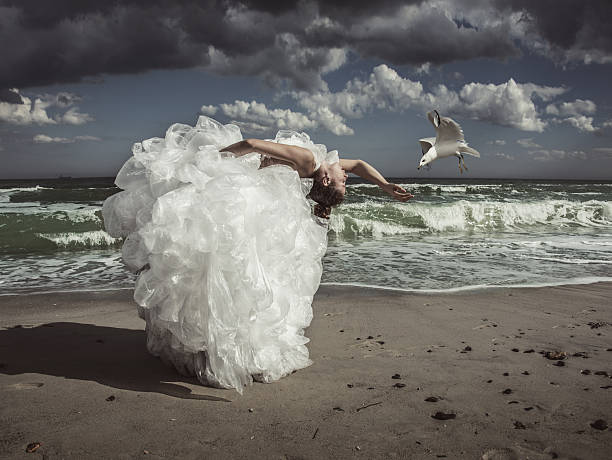 istock women in plastic bag dress 187034160