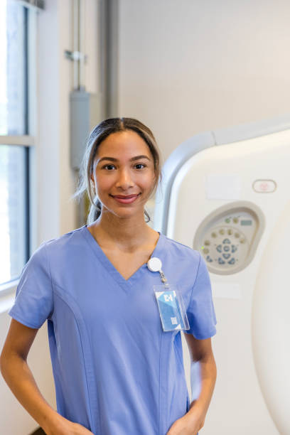 istock Confident female nurse in CT scan room 1870342605